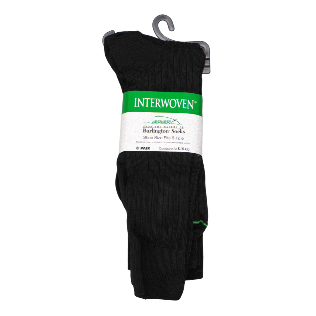 looking straight at the Three pairs of black Interwoven ribbed dress socks in it's packaging on a white background. The label is wrapped around the center of the socks as they are folded on top of each other.